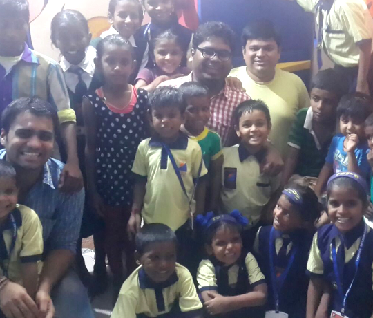 Donation of note books for street children school below western express flyover, Kandivali
